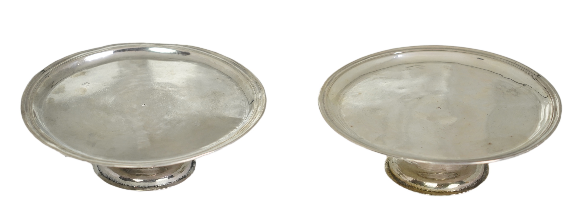 A pair of early late George I/early George II provincial silver patens, by John Elston Jnr